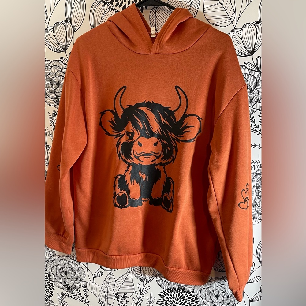 Orange Sweatshirt with Cow Graphic